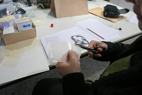 Scissors cutting paper Stock Photos