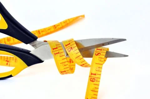 Scissors cutting Stock Photos