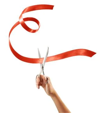 Scissors cutting through red ribbon or tape Stock Photos