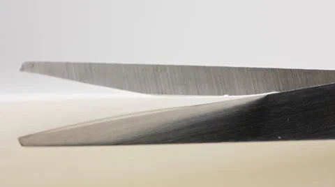 Scissors cutting white paper closeup Video stock 34235609