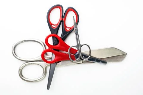Scissors for different purposes and sizes on a white background, vintage and  Stock Photos
