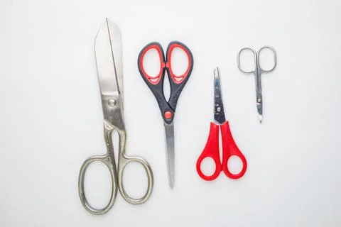 Scissors for different purposes and sizes on a white background, vintage and  Stock Photos