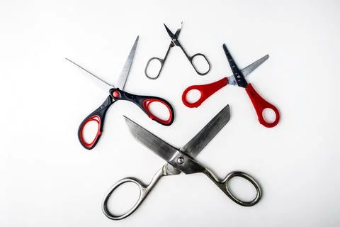 Scissors for different purposes and sizes on a white background, vintage and  Stock Photos