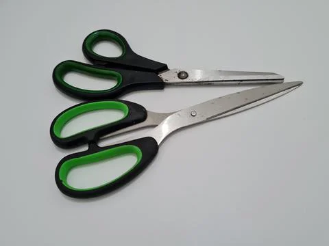 Scissors with green handles Foto stock
