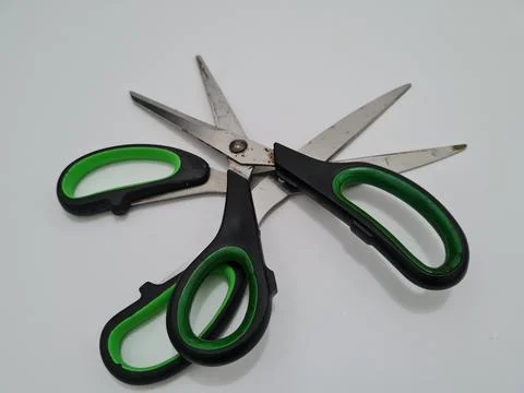 Scissors with green handles Stock Photos