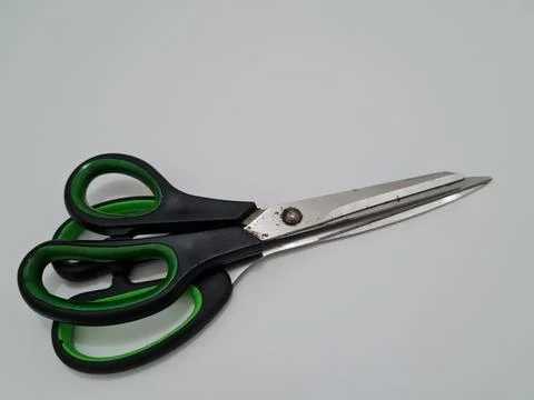Scissors with green handles Foto stock