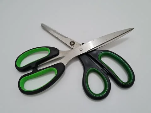 Scissors with green handles Stock Photos