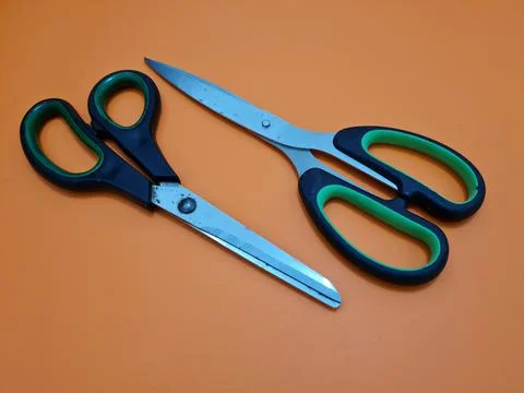 Scissors with green handles Foto stock
