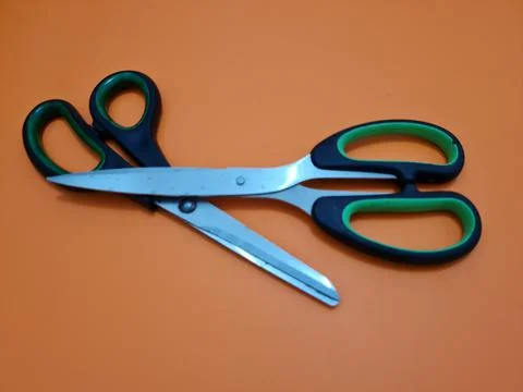 Scissors with green handles 写真素材