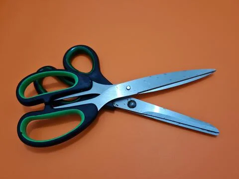Scissors with green handles Foto stock