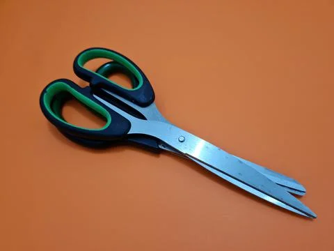 Scissors with green handles Stock Photos