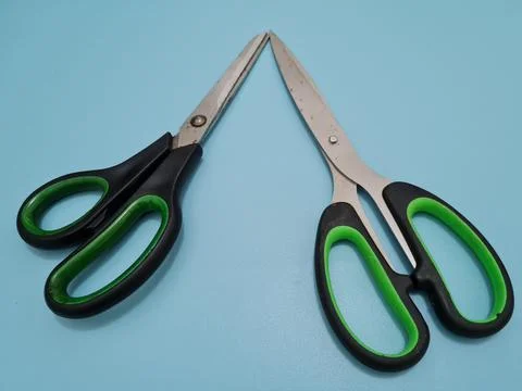 Scissors with green handles Foto stock