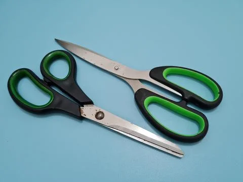 Scissors with green handles Foto stock
