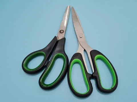 Scissors with green handles Stock Photos