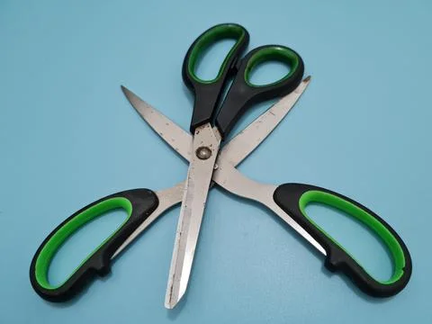 Scissors with green handles Foto stock