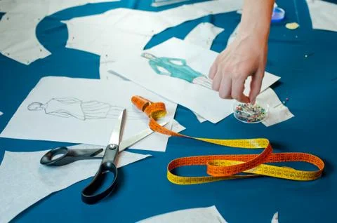 Scissors hand and pin Stock Photos