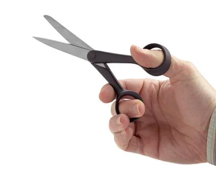 Scissors in hand isolated on white background Stock Photos