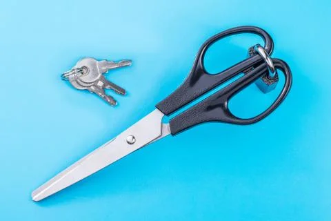 Scissors locked padlock. Keys are nearby. Stock Photos