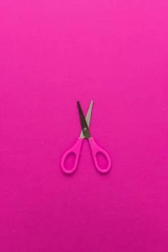 Scissors on magenta back Stock Photos