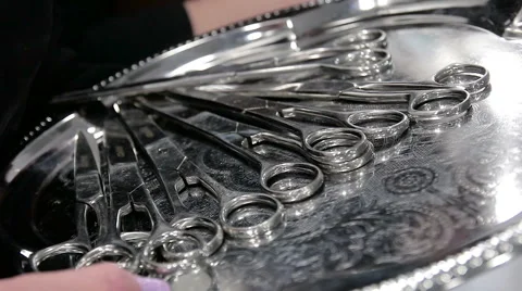 Scissors on metal plate Stock Footage 65746352