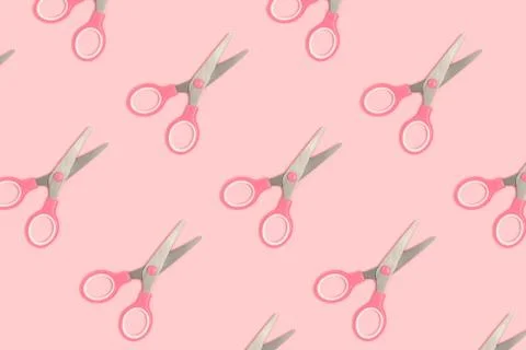 Scissors pattern on a pink pastel background. Stock Photos