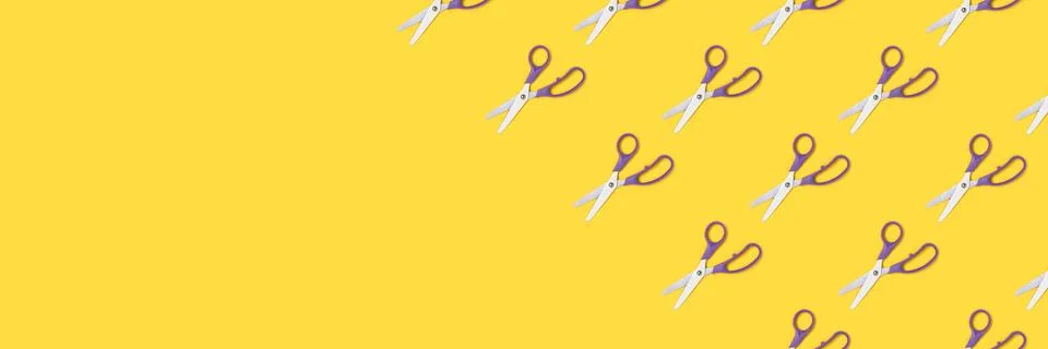 Scissors pattern on a yellow background. Stock Photos