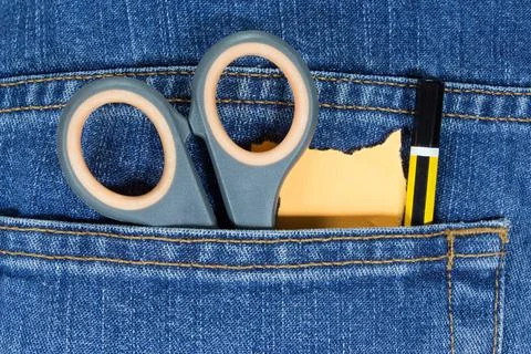 Scissors, pencil and blank note paper in pocket Stock Photos