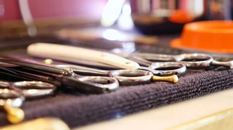 Scissors placed in a barber table Stock Footage 58673277