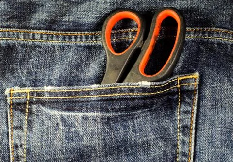 Scissors in a pocket of the jeans Stock Photos