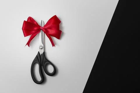 Scissors with red bow Stock Photos