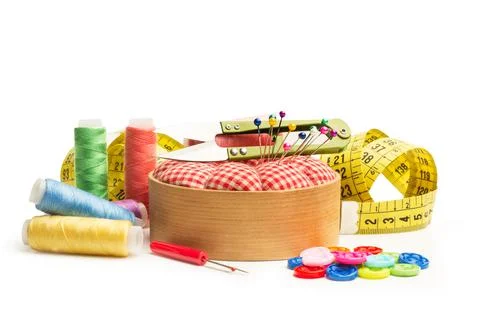 Scissors, sewing thread, buttons and sewing accessories on a white background Foto stock