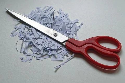 Scissors shredding paper Stock Photos