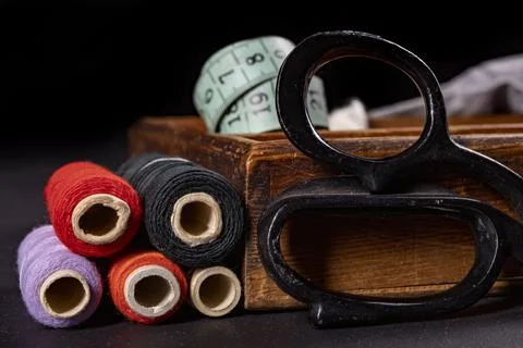 Scissors on the table in the tailor's workshop. Accessories necessary for tai Stock Photos