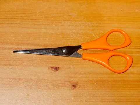 Scissors on table top closed isolated up close Stock Photos