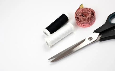 Scissors, tape measure and threads Stock Photos