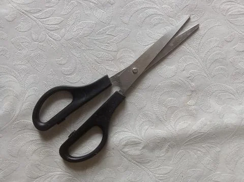 Scissors on white office table Stock Photos