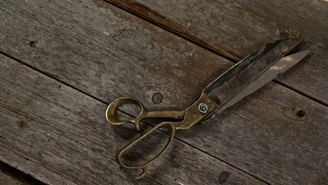 Scissors on wooden table Video stock 84712255