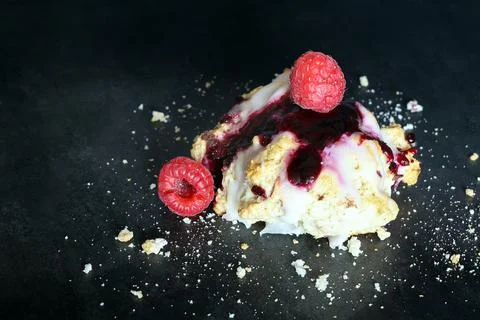 Scones with raspberry jam and lemon glaze on top Stock Photos