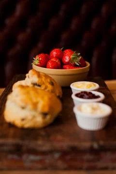 Scones with Strawberries, Raspberry Jam and Clotted Cream Stock Photos