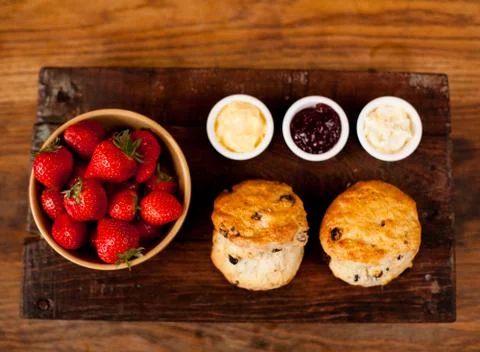 Scones with Strawberries, Raspberry Jam and Clotted Cream Stock Photos