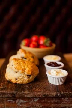 Scones with Strawberries, Raspberry Jam and Clotted Cream Stock Photos