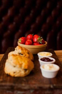 Scones with Strawberries, Raspberry Jam and Clotted Cream Stock Photos