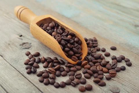 Scoop with coffee beans Stock Photos