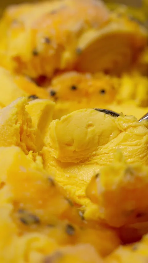 Scoop of mango ice cream. Concept of sweet frozen food. Stock Footage 280712649