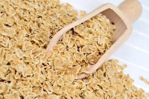 Scoop with oats on table Stock Photos