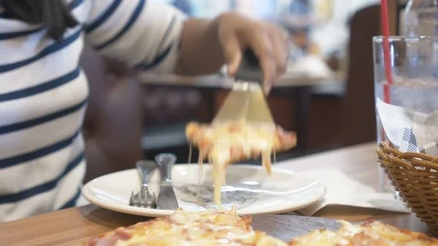 Scoop the pizza into the dish Stock Footage 105113099
