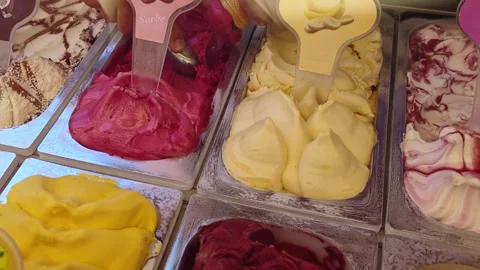 Scoop portion of ice cream from container with spoon. Stock Footage 319391217