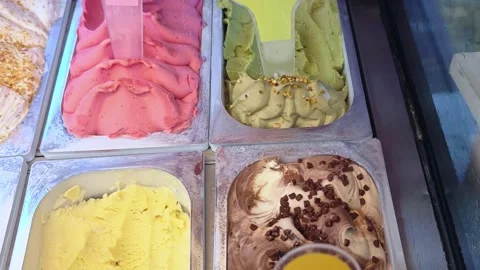 Scoop portion of ice cream from container with spoon. Stock-Footage 319396012