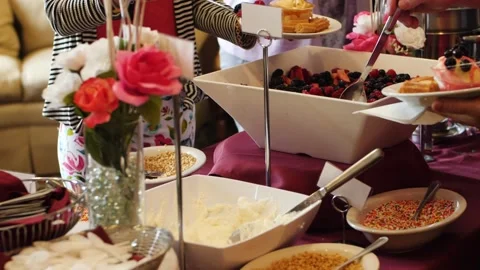Scooping up berries at the buffet Stock Footage 137348346