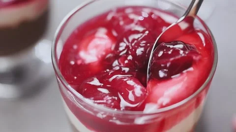 Scooping chocolate pudding with a spoon. Stock Footage 153459234